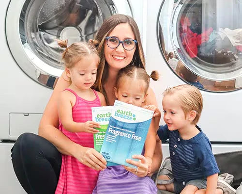 Women with children holding eb sheets